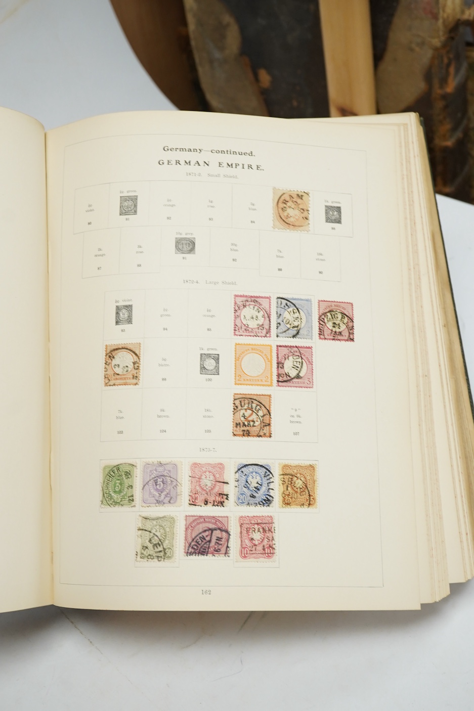 Three Edwardian and later stamp albums, The Grafton Stamp Album, containing a good selection of British stamps from 1841 to 1978, including Two Pence blue, 1840s/50s Penny Reds, Victoria Army Official, a substantial run